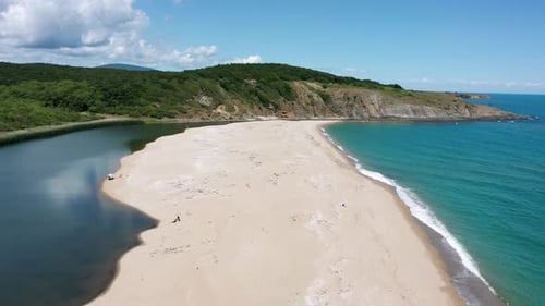 Drone flight over a picturesque sandy beach