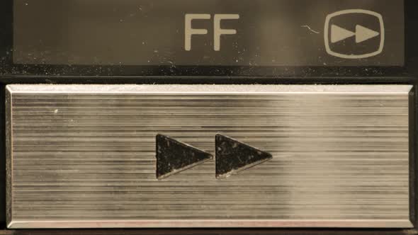 Extreme close up of buttons on an old antique or vintage VCR Pushing ...