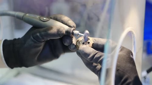 Jeweler Hands Working With A Ring