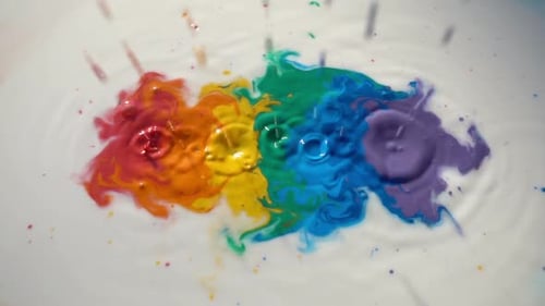 Colorful Liquid Splash Creating Rainbow Pattern