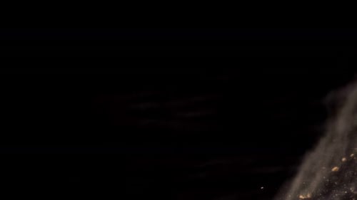 Abstract Particles and Dust on Black Background