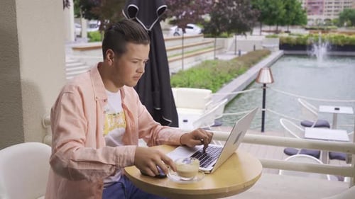 Drinking coffee in the cafe.