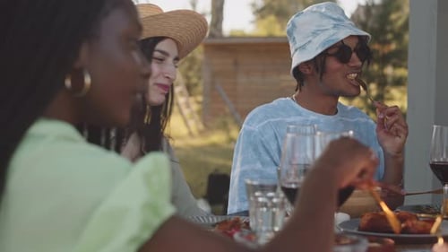 Friends Share Meal Outdoors on a Summer Day