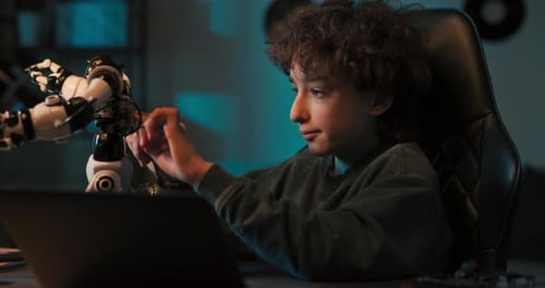 Shocked the Boy Programmed the Robot Using His Laptop the Toy Came to Life Began to Go Crazy