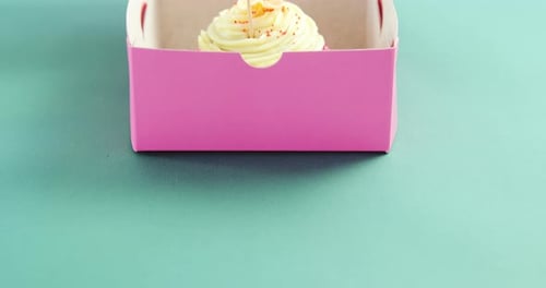 Cupcake with happy mother day card against green background