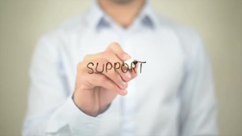 Person Writing the Word Support