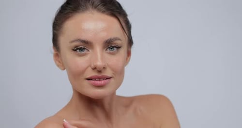 Attractive Woman Posing in a Studio with Makeup