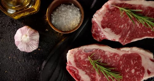 Raw Beef Steaks with Herbs and Spices