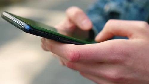 Hands Using Smartphone Device for Digital Interaction