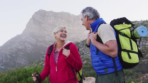 Mature Couple Hiking in Scenic Mountains