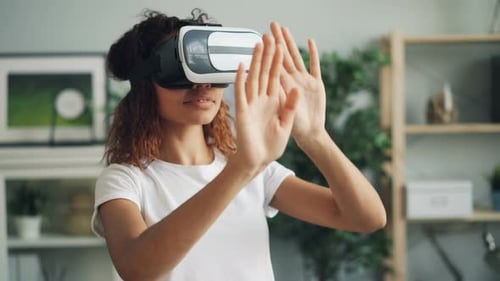 Young Woman Using VR Headset in Living Room