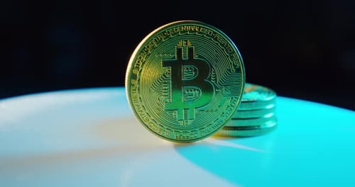 One Bitcoin Coin Rotates. Close Up