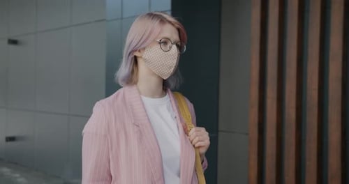 Young Businesswoman Wearing Face Mask Walking Outdoors in City Street During Covid19 Quarantine