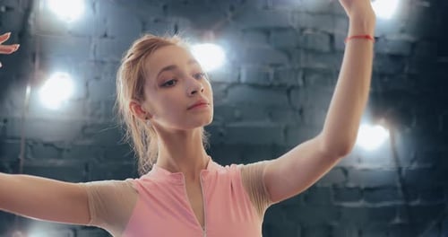 Woman Gracefully Practicing Hand Movements