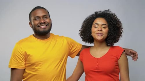 Affectionate Young Couple Smiling and Embracing