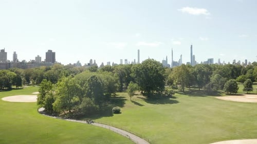 Beautiful Central Park View and Manhattan Skyline in Background at Sunny Summer Day