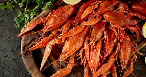 A Bunch of Boiled Crayfish on the Cutting Board Rotates.