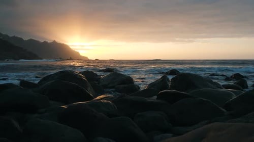 Slow Motion. Ocean Waves in Beautiful Sunset Light on Benijo Beach in Tenerife, Canary Islands. Big