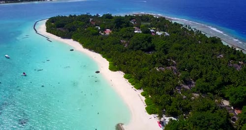 Luxury overhead island view of a paradise sunny white sand beach and blue water background in colorf
