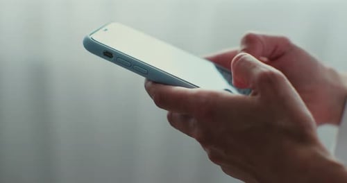 Hands Using Modern Mobile Phone Close Up