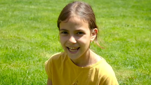 Child Girl Laughing in the Park