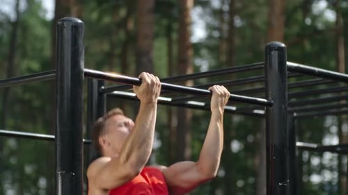 Athletic man Doing Chin Ups