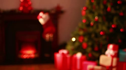 Blinking lights on christmas tree with presents