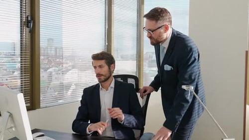 Men Discussing Business in Modern Office