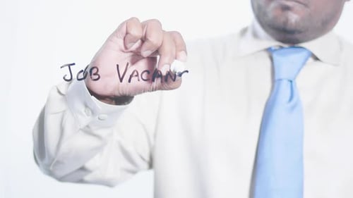 Asian Businessman Writes Job Vacancy