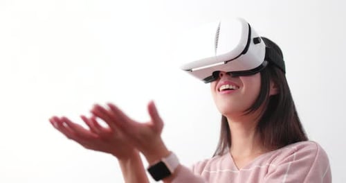 Woman Wearing VR Headset in a Bright Studio