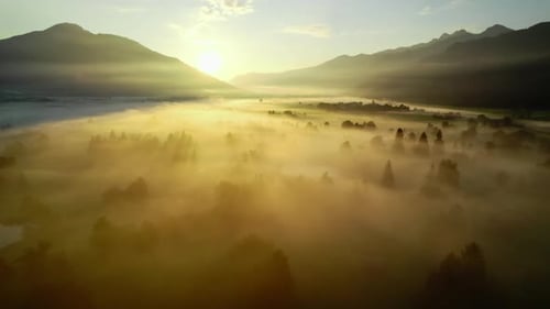 Golden Sunrise over Foggy Rural Valley