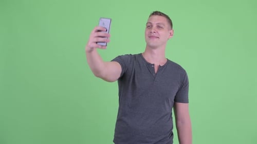 Young Man Taking a Selfie With Phone