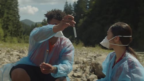 Scientists Testing Water Quality in a Forest River