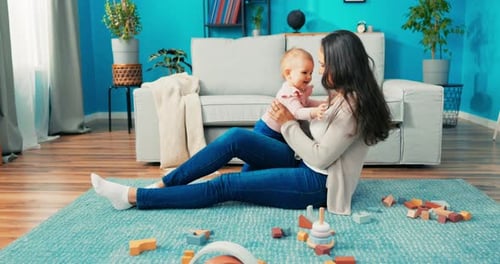 Mother and Baby Playing with Toys at Home