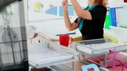 Woman Using VR Headset in Modern Office
