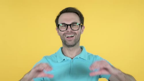 Man Makes a Heart Shape with His Hands