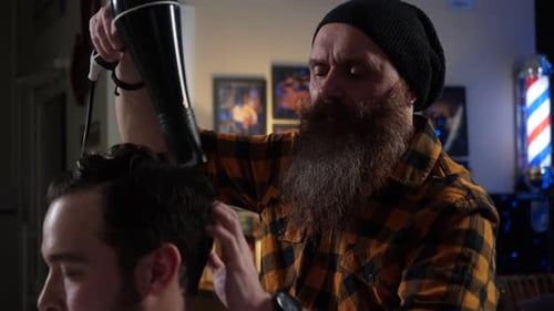Barber Styling Man's Hair With Hair Dryer