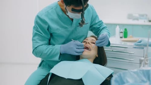 Dentist Examining Patient in Modern Office