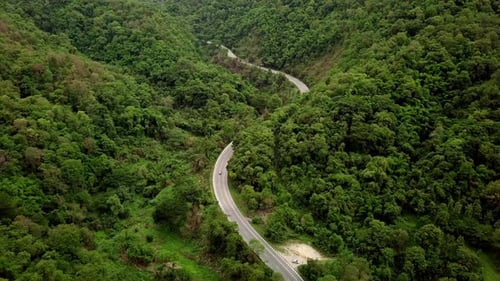 Aerial View Of Countryside Road Passing Through The Mountain Landscape