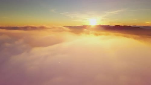 Aerial View of Dreamy Clouds at Sunrise