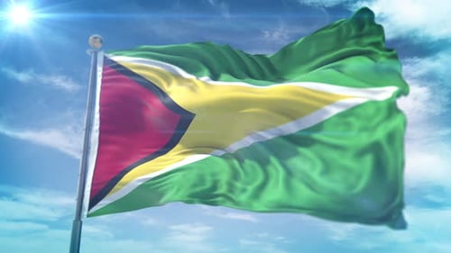 Realistic Waving Flag of Guyana Against Blue Sky