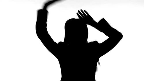 Woman's Silhouette Dancing Against White Background