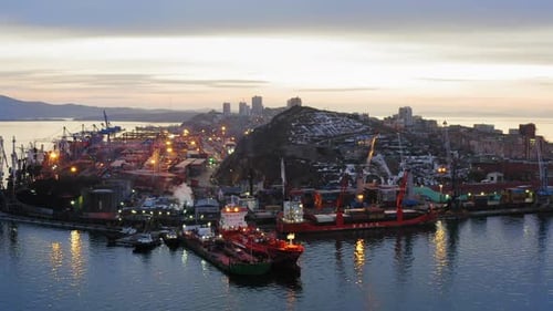 Drone View of the Cargo Terminal with Port Cranes at Sunset