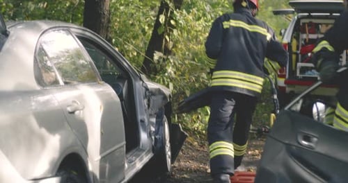 Firefighters Cutting Car Door and Saving Woman