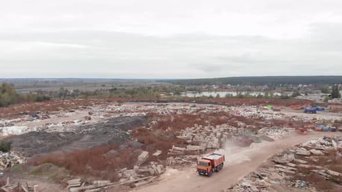 Aerial View of Landfill with Garbage Truck