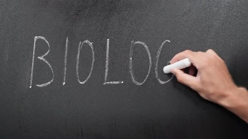 Biology subject lesson title writing on school blackboard.