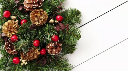 Evergreen Christmas Wreath on White Wooden Background