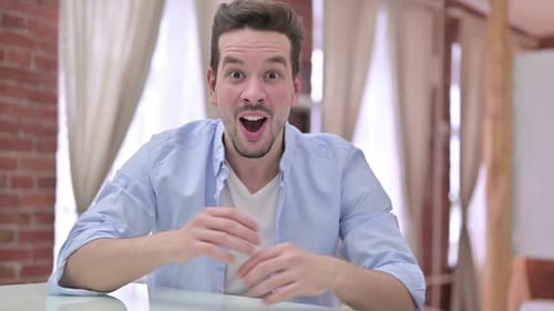 Young Adult Man Expressing Excitement and Joy