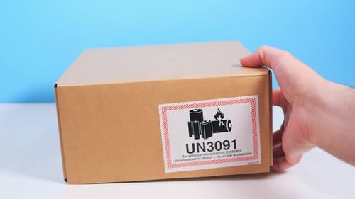 Brown Shipping Box Placed On White Table