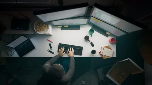 Programmer Working on Multi-Monitor Workstation